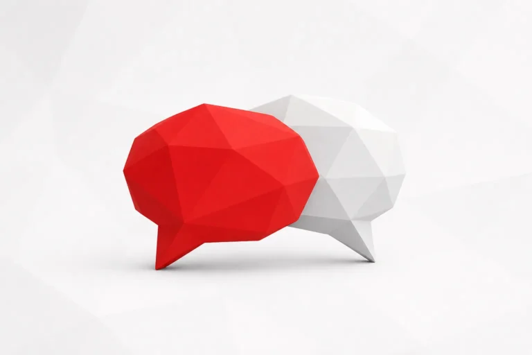 Dos bocadillos de conversación facetados y superpuestos, el de delante rojo y el de detrás blanco
